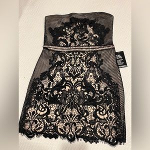 Straples Dress Thick Black lace/ Nude lining under.